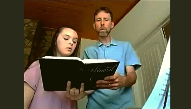 daughter and father sing from home