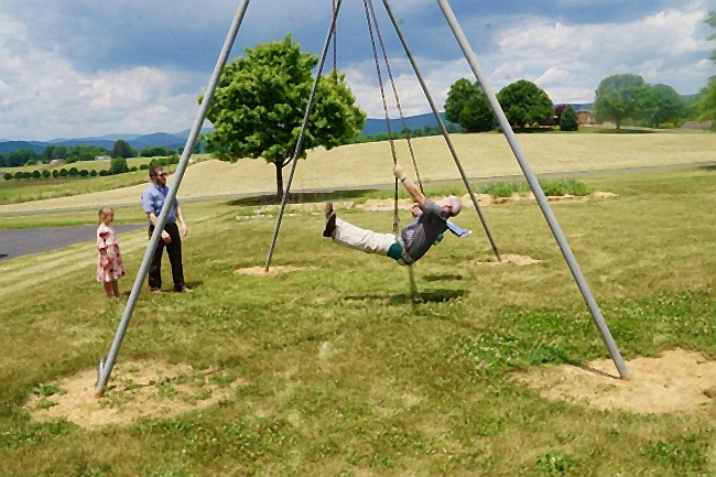 an adult, les, gives the swing a try
